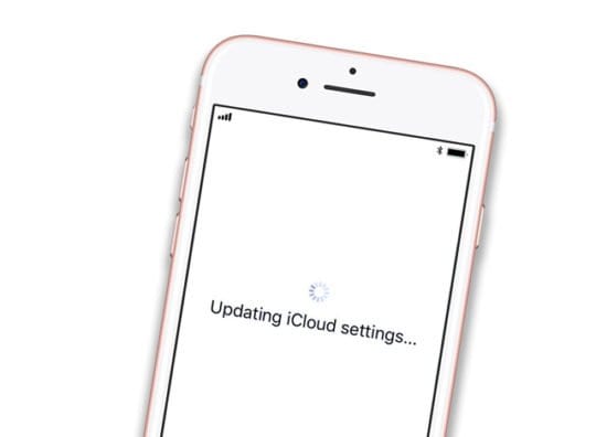 iPhone with Updating iCloud Settings on White Set Up Screen